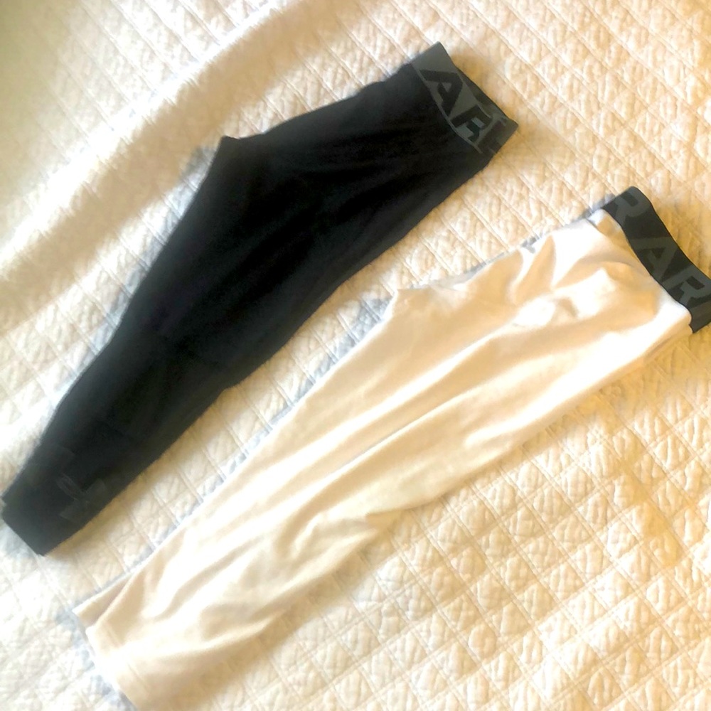 Two pairs of under Armour boys athletic tights size large